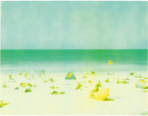 Pinhole photograph of Bondi Beach with beachgoers, sand and a turquoise sea.