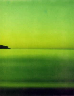 Green-toned dawn seascape at Umina Beach with a small headland on the left.